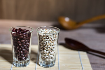 Cereals in glass cups placed on a wooden background