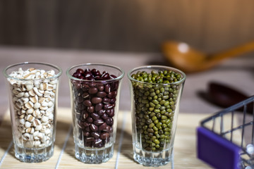 Cereals in glass cups placed on a wooden background