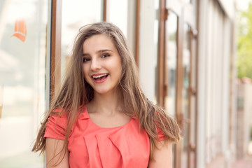 Beautiful and happy teen in the city enjoying the summer.