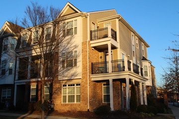 Modern townhouses with balconies in the sunny day, Virginia, USA
