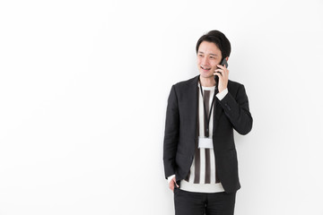 portrait of young asian man wearing suit isolated on white background