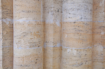 The texture and background of the wall of stone. Stone columns.