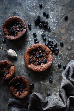Overhead view of flourless chocolate blueberry cakes