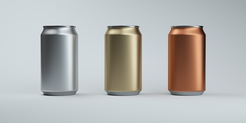 Three metallic color soda cans on elegant dark background