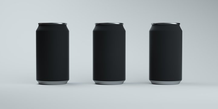 Three matte dark soda cans on elegant light background