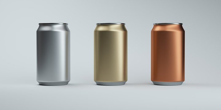 Three metallic color soda cans on elegant dark background