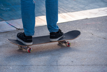 skater legs riding a skate