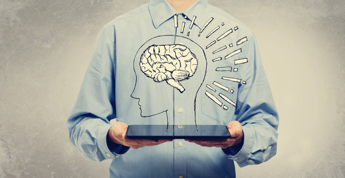 Brain illustration with young man holding a tablet computer