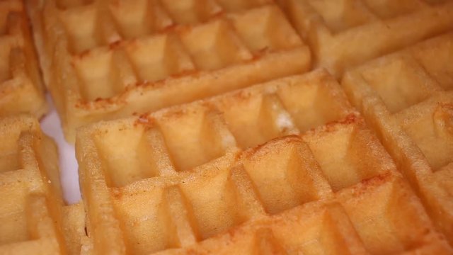 Waffle waffles food closeup texture pattern. Seamless looping video footage