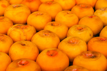The persimmon fruits closeup and background