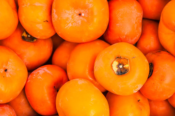 The persimmon fruits closeup and background