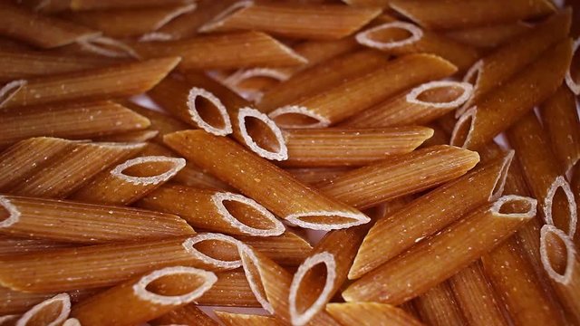 Durum wheat pasta food closeup texture pattern. Seamless looping video footage