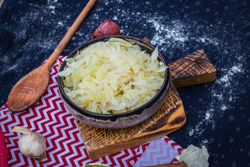 Cooked, boiled, sauteed white cabbage.  Vegetarian lunch, vegan dinner, healthy food.