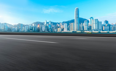 Fototapeta premium Road and skyline of modern urban architecture in Hong Kong..