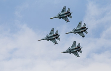 Flying aerobatic team of MiG "Swifts" in the sky