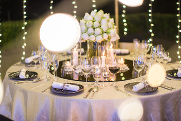 Table setting at a luxury wedding and Beautiful flowers on the table.