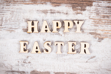 Inscription Happy Easter on rustic board