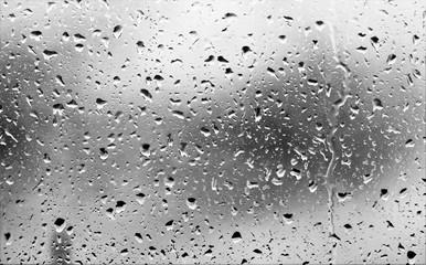 drops of rain on the glass, black and white photo