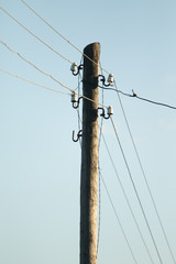 pole with electric wires in the open air