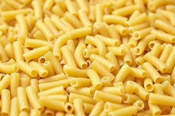Tortiglioni italian pasta is short pasta with ribbed surface and straight cut, similar to small tubes