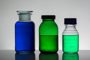 Liquid in laboratory bottles. Scientific biochemical laboratory. Colorful liquid.