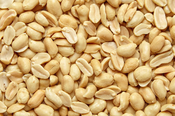 roasted peanuts, salted snack as background, top view