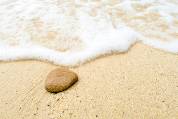 Fototapeta na wymiar Ocean sea water rushing in to sandy beach shore