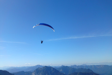 Paragliding above Alps mountain range from Dachstein, Austria