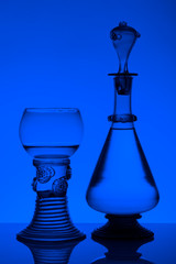 Middle age rummer wine glass and bottle on the white background.