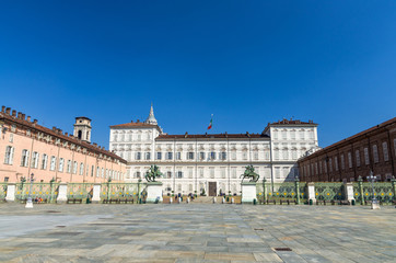 Fototapeta na wymiar Royal Palace Palazzo Reale building on Castle Square Piazza Castello with fountains and monuments in historical centre of Turin Torino city with clear blue sky, Piedmont, Italy