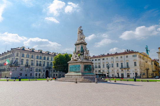Monumento a Camillo Benso conte di Cavour statue on Piazza Carlo Emanuele II square with old buildings around in historical city centre of Turin Torino city in beautiful summer day, Piedmont, Italy