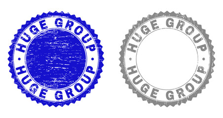 Fototapeta na wymiar Grunge HUGE GROUP stamp seals isolated on a white background. Rosette seals with grunge texture in blue and gray colors. Vector rubber stamp imprint of HUGE GROUP title inside round rosette.
