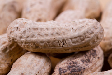 Peanut in a shell on a wooden background