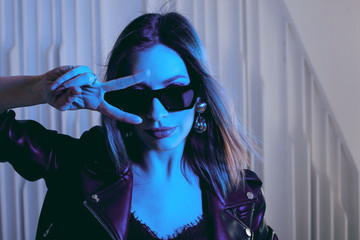 Beautiful girl dancing in retro wave on the neon light