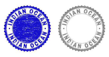 Grunge INDIAN OCEAN stamp seals isolated on a white background. Rosette seals with grunge texture in blue and gray colors. Vector rubber stamp imitation of INDIAN OCEAN title inside round rosette.