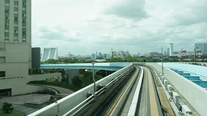 Fototapeta premium Railway of Yurikamome Train system in Tokyo Japan. Turn in the Road