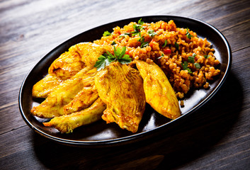 Roasted meat, groats and vegetables