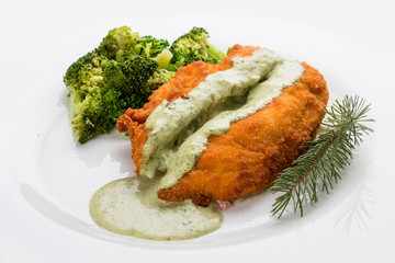 Chicken fillet with avocado sauce on white background
