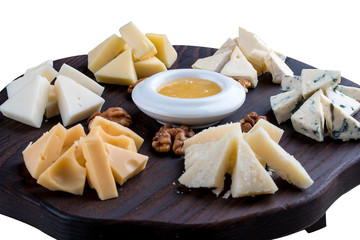 A set of different cheeses on a wooden Board. Cheese Board.