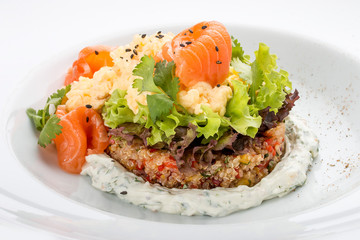 Scrambled eggs with salmon on a bed of quinoa.
