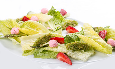 Salad with strawberries and sweet cheese on a white background. Diet dish
