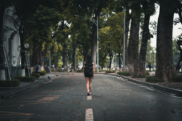 Fototapeta premium Woman backpacker exploring Hanoi street Vietnam