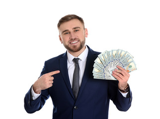 Portrait of young businessman holding money banknotes on white background