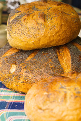 Pieces loaf of bread with poppy seeds