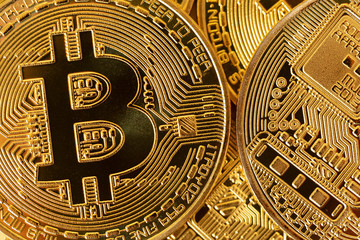 Fototapeta na wymiar Top view closeup photo of gold bitcoins in a pile