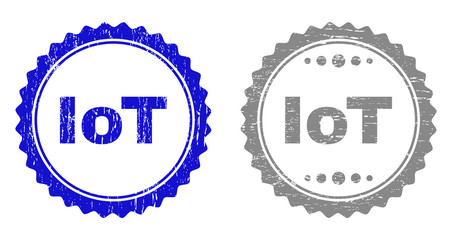 Grunge IOT stamp seals isolated on a white background. Rosette seals with grunge texture in blue and grey colors. Vector rubber overlay of IOT caption inside round rosette.