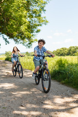 Obraz premium Urban biking - kids riding bikes