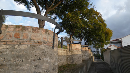 Narrow passage behind brick built seats