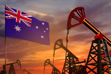 Australia oil industry concept. Industrial illustration - Australia flag and oil wells with the red and blue sunset or sunrise sky background - 3D illustration