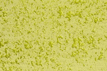 abstract aged yellow limestone like stucco texture for use as background.